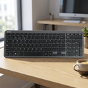 Teclado Inalámbrico Cygna Slim Grafito - a modern workspace with a coffee cup, natura