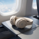 Audifonos Bluetooth Inalambricos Over  - on an airplane tray table by the window