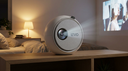 Proyector LED Portátil Focus Mini 720p - a cozy bedroom at night with warm lamp light